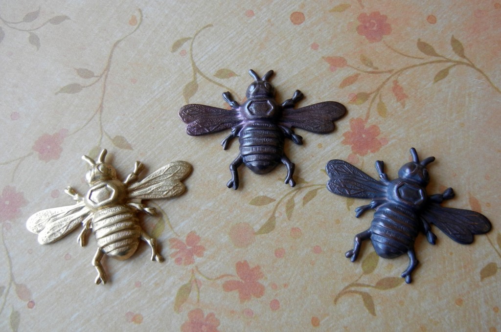 bee charms, raw and with heat patina