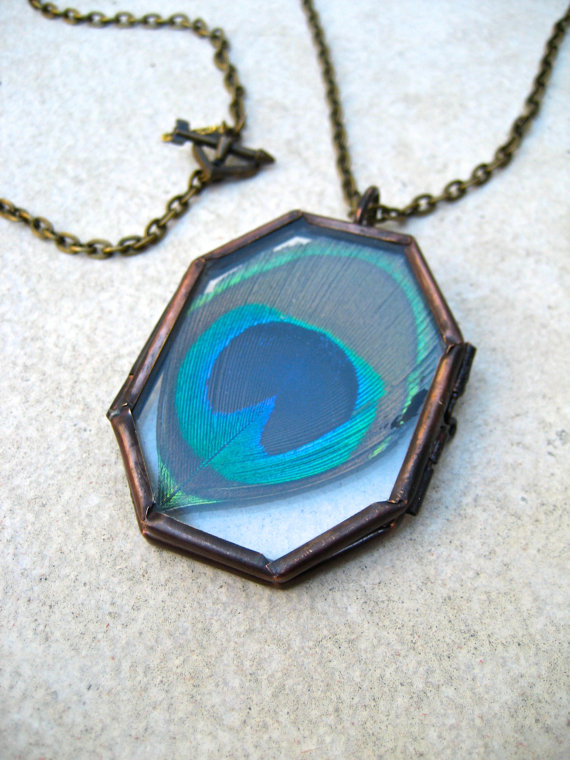 This necklace by Jen Gers of Piece Lust features a pendant that frames a real peacock feather! How cool is that?