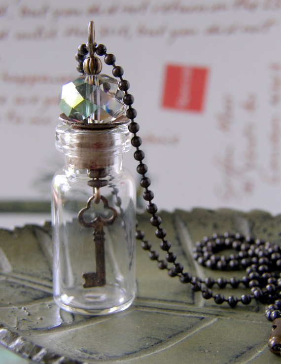 This necklace is so fun! It has a cute skeleton key suspended in a small glass vial. This piece is by Mollie Valiente of Ethereal Girls.  Her shop features tons of unique mixed media jewelry. 