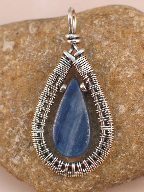 This necklace features an amazingly blue piece of kyanite framed by intricate wire wire. This necklace can be found  at Stephanie Taylor's etsy store, Peacock Blu Creations. 