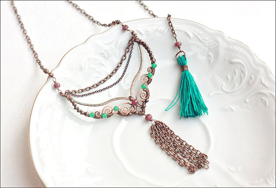 This beautiful necklace has a chain tassel on the front and a teal tassel on the back. Plus the wire work is just amazing! It can be found at the etsy store SabiKrabi. 