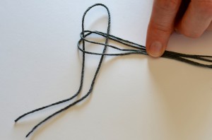 Connecting cords to begin macrame.