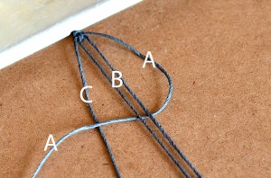 Starting a square knot.