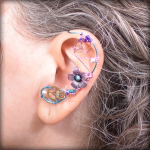 Wire-wrapped ear cuff made with genuine watch gears.