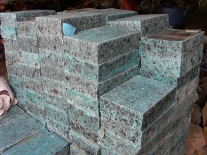 Large pile of manmade imitation turquoise block at a Chinese Materials seller visited by Russ Nobbs in 1996. 