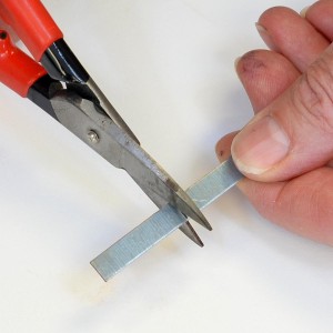 Cut the Metal Strip with Shears