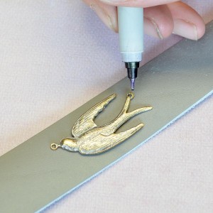 Use an ultra fine tip marker to mark the hole placement.