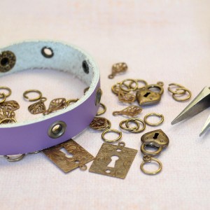 Start with adding eyelets to a leather bracelet, then add the fun!
