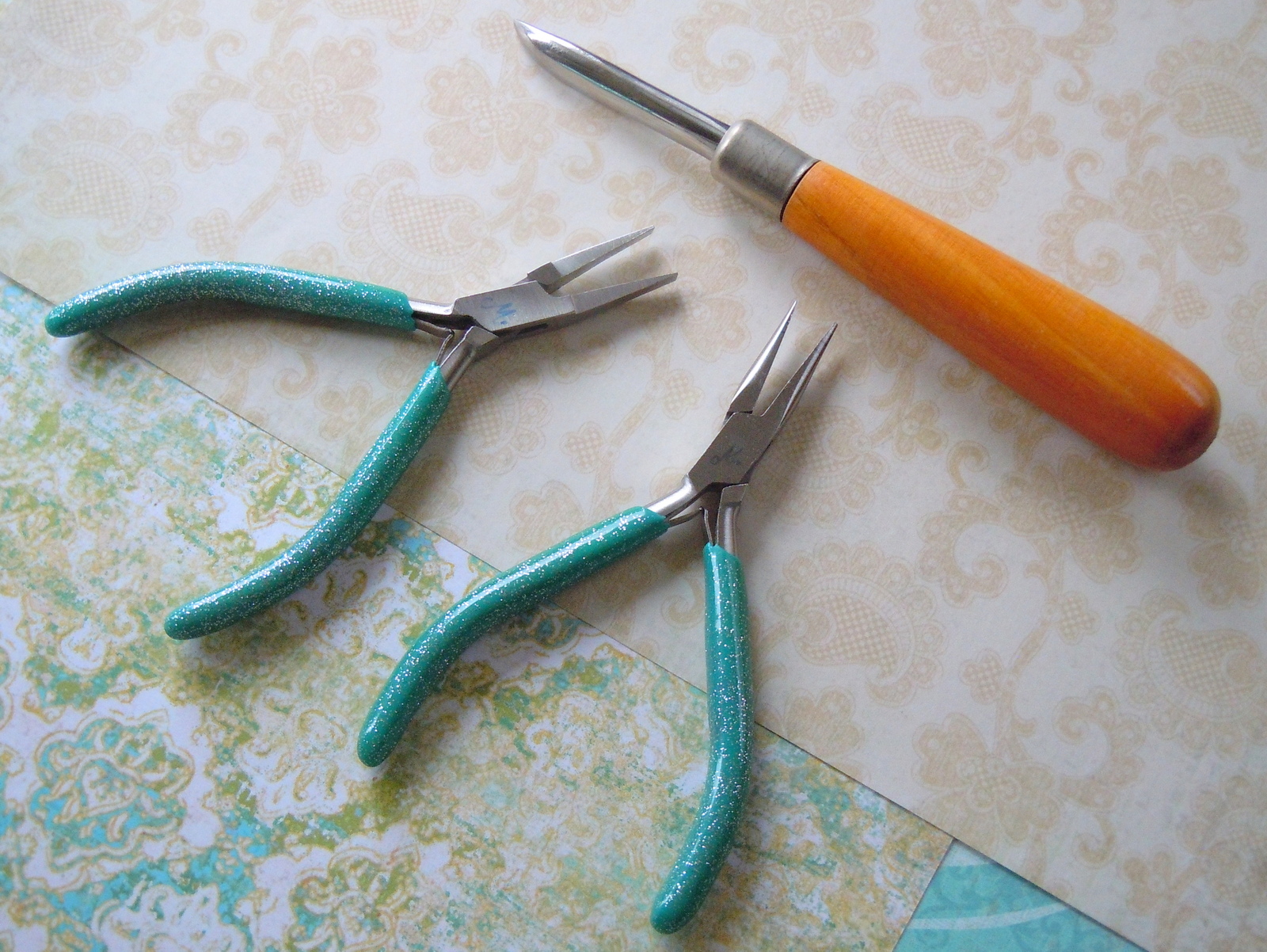 This jewelry-making project requires just three tools: flat-nose pliers, chain-nose pliers, and a steel burnisher.